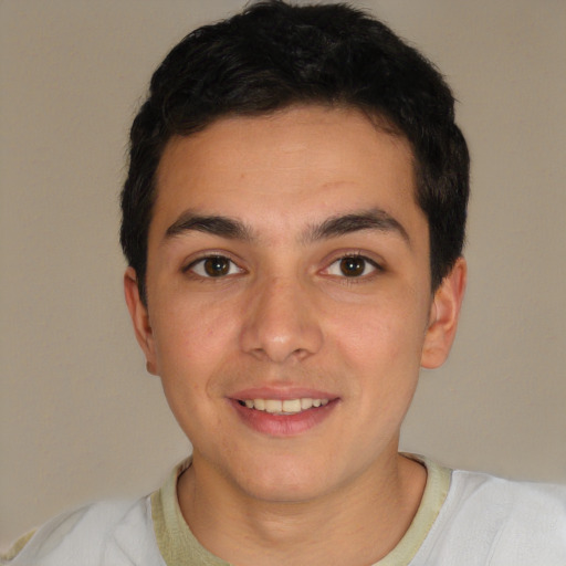Joyful white young-adult male with short  black hair and brown eyes