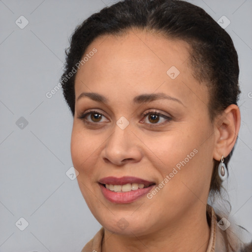 Joyful white adult female with medium  brown hair and brown eyes