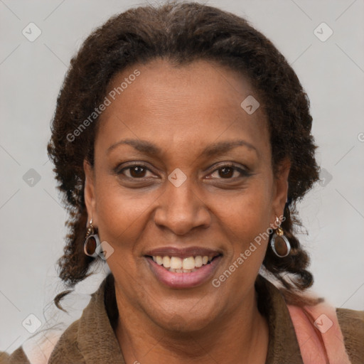 Joyful black adult female with short  brown hair and brown eyes