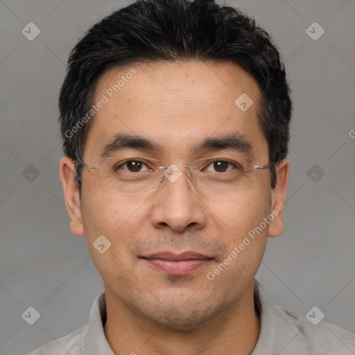 Joyful white adult male with short  black hair and brown eyes