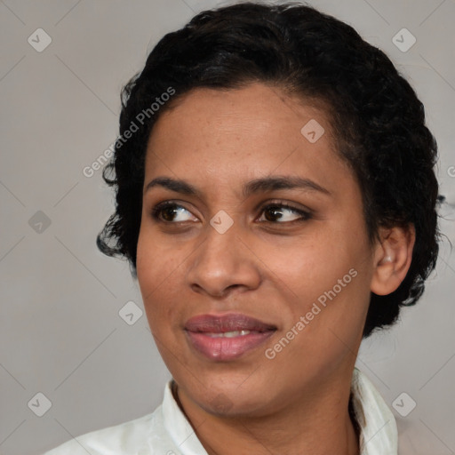 Joyful latino young-adult female with medium  brown hair and brown eyes