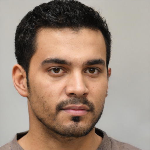 Neutral latino young-adult male with short  black hair and brown eyes