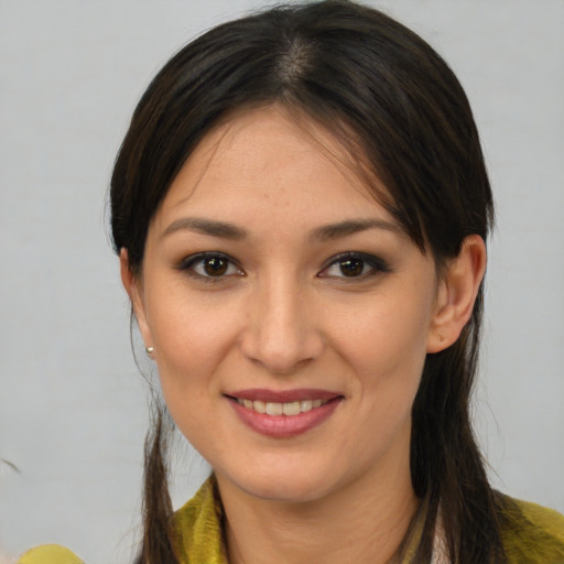 Joyful white young-adult female with medium  brown hair and brown eyes