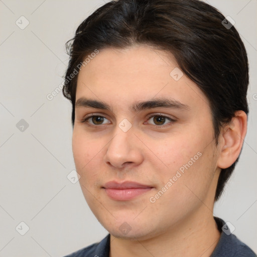 Joyful white young-adult male with medium  brown hair and brown eyes