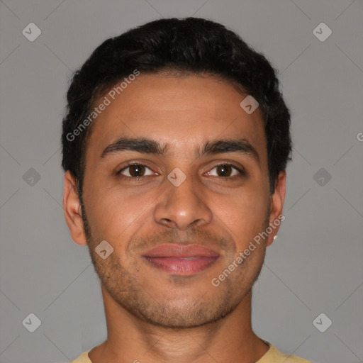 Joyful latino young-adult male with short  brown hair and brown eyes