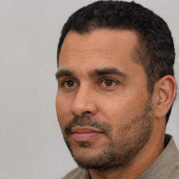 Neutral white adult male with short  black hair and brown eyes