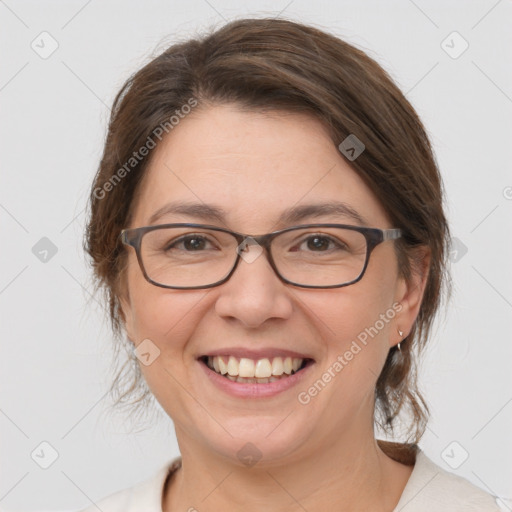 Joyful white adult female with medium  brown hair and grey eyes