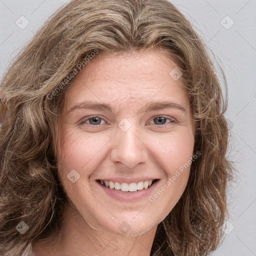 Joyful white young-adult female with long  brown hair and green eyes