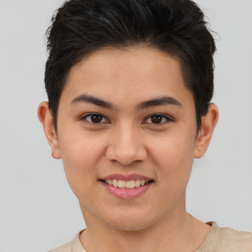 Joyful asian young-adult female with short  brown hair and brown eyes