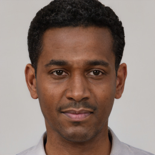 Neutral black young-adult male with short  black hair and brown eyes