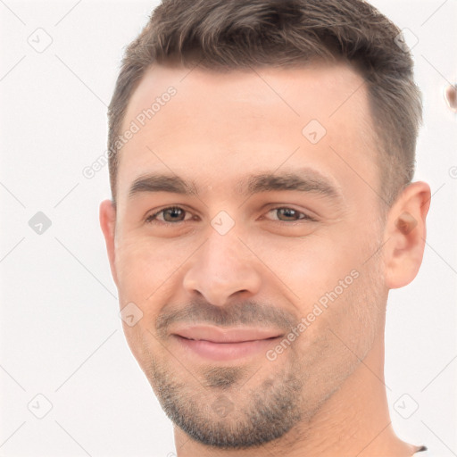 Joyful white young-adult male with short  brown hair and brown eyes