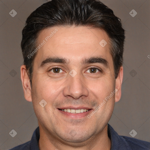 Joyful white adult male with short  brown hair and brown eyes