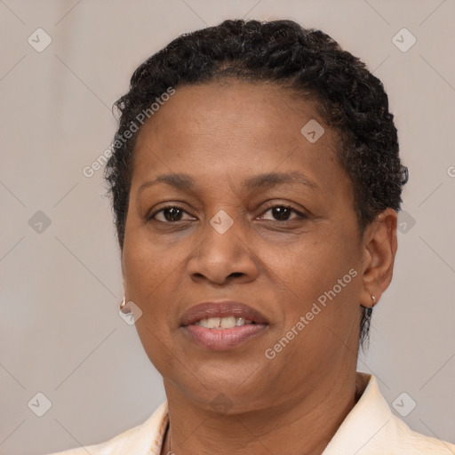 Joyful black adult female with short  brown hair and brown eyes