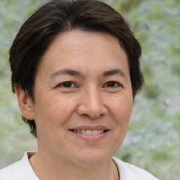 Joyful white adult female with short  brown hair and brown eyes