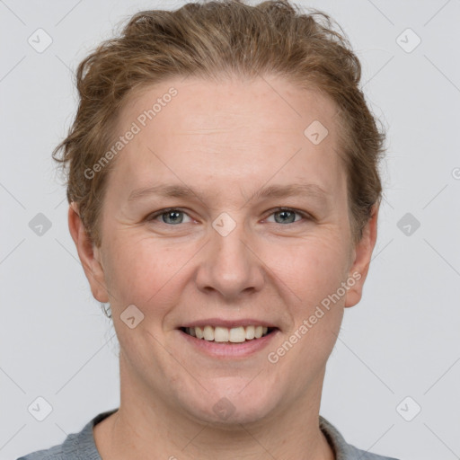 Joyful white adult female with short  brown hair and grey eyes