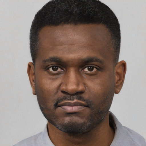 Neutral black young-adult male with short  black hair and brown eyes