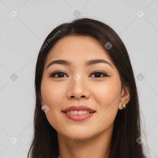 Joyful white young-adult female with long  brown hair and brown eyes