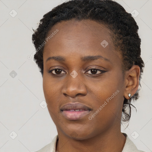 Neutral black young-adult female with short  brown hair and brown eyes