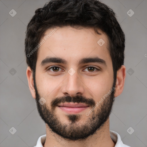 Joyful white young-adult male with short  black hair and brown eyes