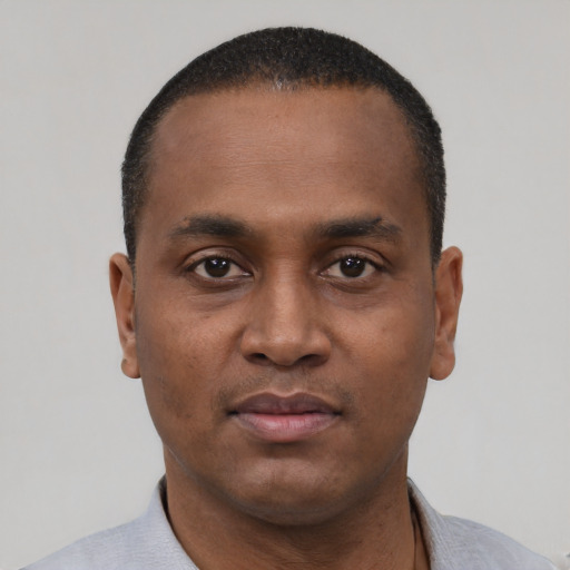 Neutral black young-adult male with short  black hair and brown eyes