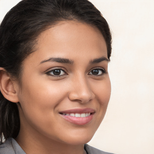 Joyful white young-adult female with long  brown hair and brown eyes