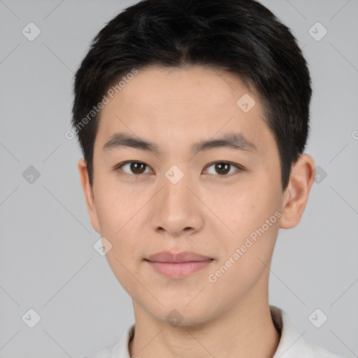 Joyful asian young-adult male with short  brown hair and brown eyes