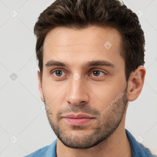 Neutral white young-adult male with short  brown hair and brown eyes