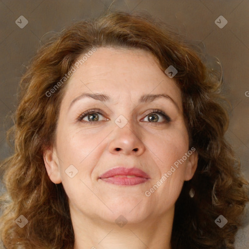 Joyful white adult female with medium  brown hair and green eyes