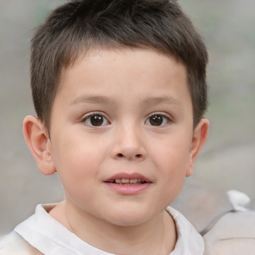 Joyful white child male with short  brown hair and brown eyes