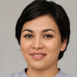 Joyful asian young-adult female with short  black hair and brown eyes