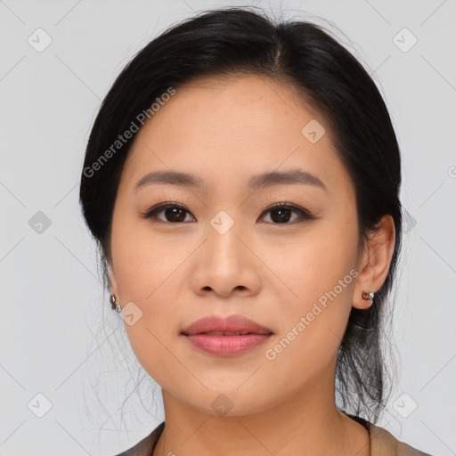 Joyful asian young-adult female with medium  black hair and brown eyes