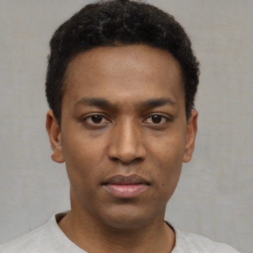 Neutral black young-adult male with short  black hair and brown eyes