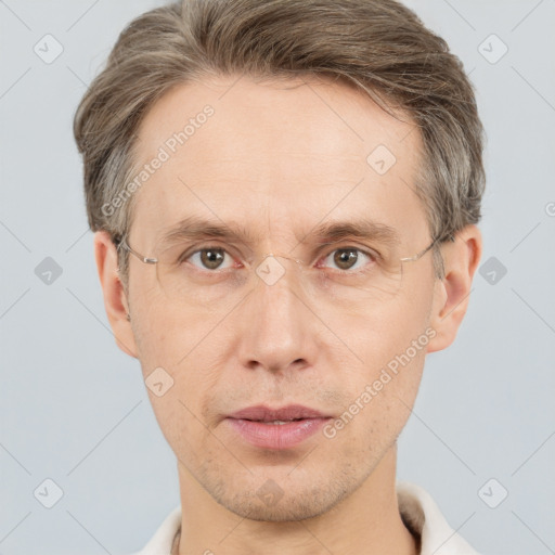 Neutral white adult male with short  brown hair and grey eyes