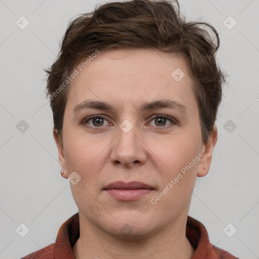 Joyful white adult female with short  brown hair and grey eyes