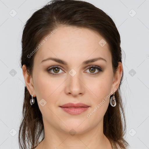 Joyful white young-adult female with long  brown hair and green eyes