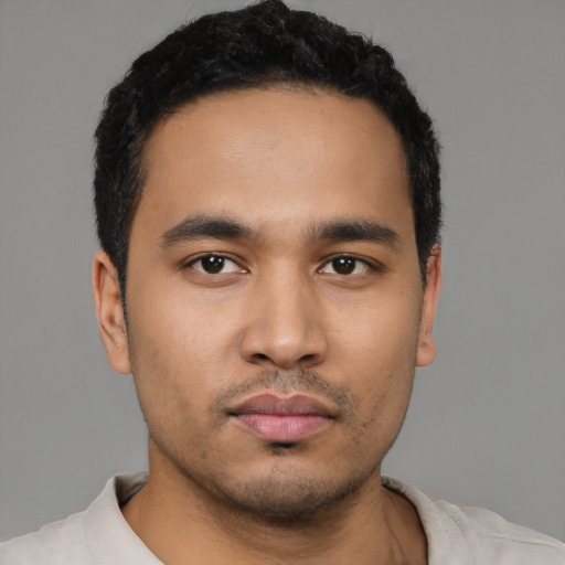 Neutral latino young-adult male with short  black hair and brown eyes
