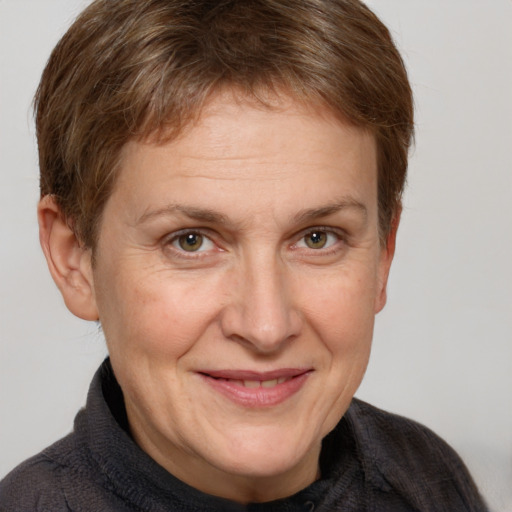 Joyful white adult female with short  brown hair and grey eyes