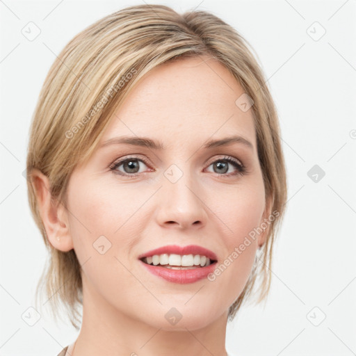 Joyful white young-adult female with medium  brown hair and blue eyes