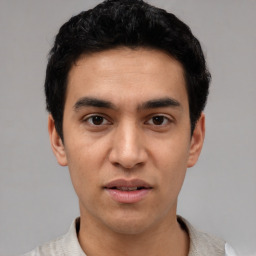 Neutral white young-adult male with short  black hair and brown eyes