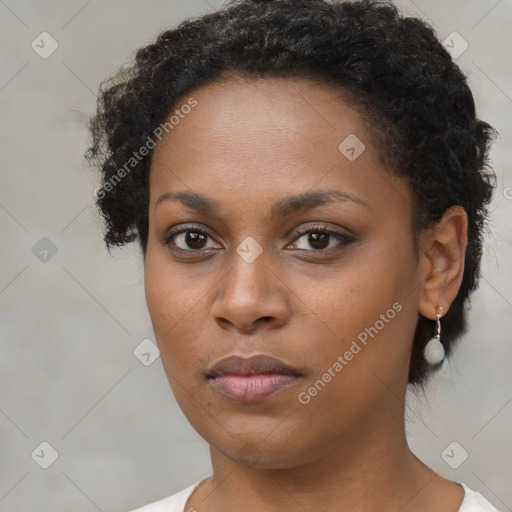 Neutral black young-adult female with short  brown hair and brown eyes