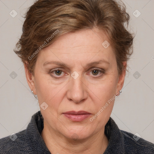 Joyful white adult female with medium  brown hair and blue eyes