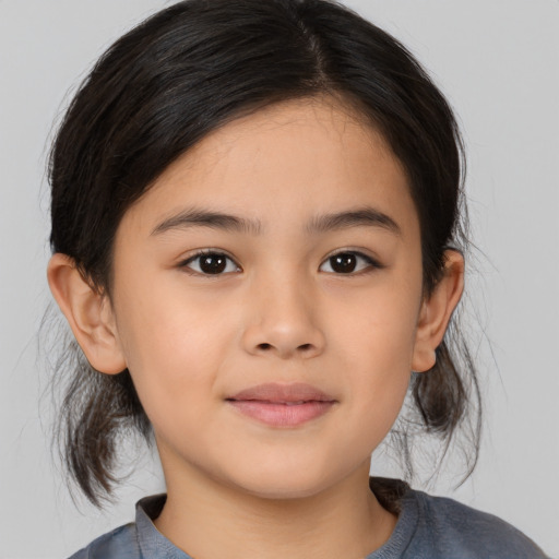 Joyful asian child female with medium  brown hair and brown eyes