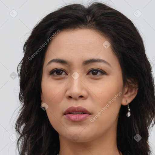 Joyful latino young-adult female with long  brown hair and brown eyes