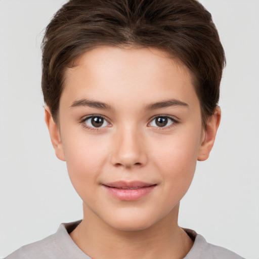 Joyful white child female with short  brown hair and brown eyes