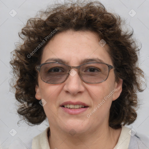 Joyful white adult female with medium  brown hair and blue eyes