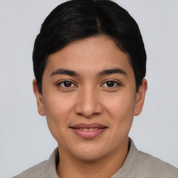 Joyful asian young-adult male with short  black hair and brown eyes