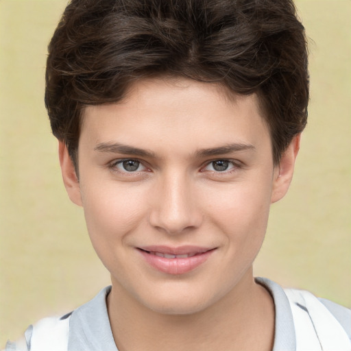 Joyful white child female with short  brown hair and brown eyes