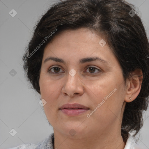 Joyful white adult female with medium  brown hair and brown eyes