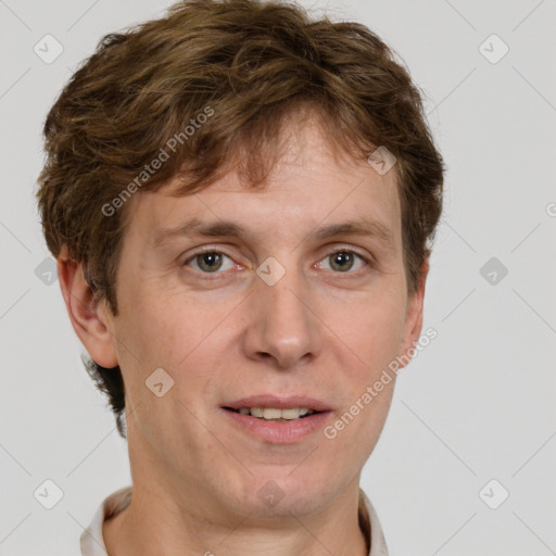 Joyful white adult male with short  brown hair and grey eyes