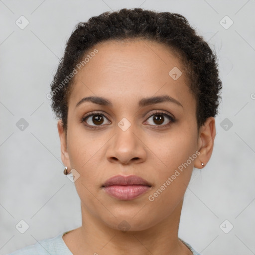 Joyful latino young-adult female with short  brown hair and brown eyes